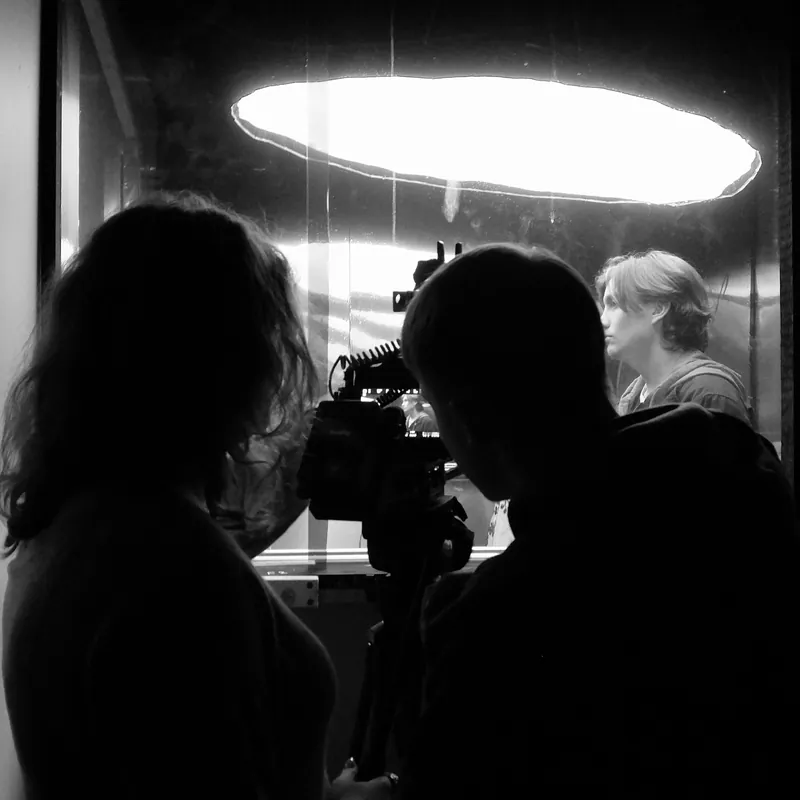 The lit set · camera through the mirror · cast inside