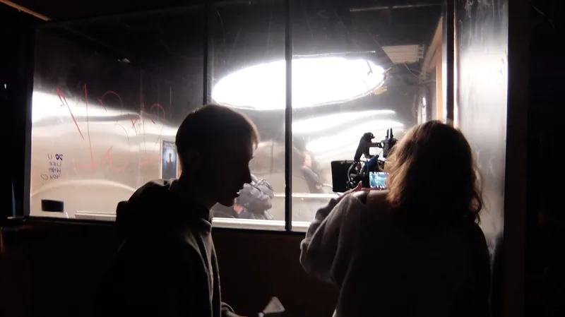 The lit set · camera through the mirror · cast inside