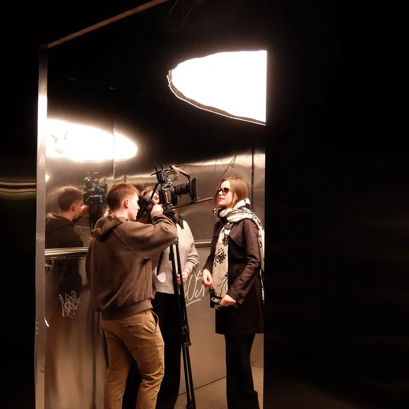 The lit set · camera through the mirror · cast inside